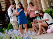 college students with smartphones